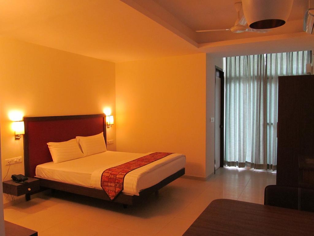 Ixora Suites Bangalore Quarto foto
